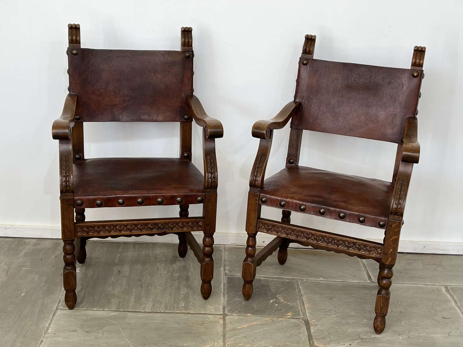 A pair of Spanish oak & Leather armchairs circa 1930