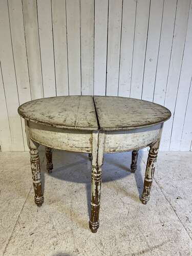 A pair of painted demi-lune tables circa 1840